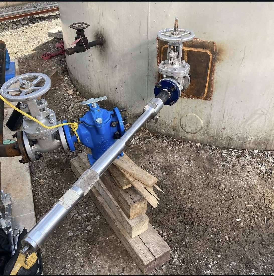 Hot tap and newly installed isolation valve on an exterior pipe run